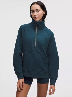 Lululemon Scuba Oversized Funnel-Neck Half Zip in a teal color